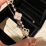 GLOSSMOON Sakura Cleef Bracelet Fashionable and Elegant Cherry Blossom Bracelet Does Not Change Color and Is Not Allergic  The Sakura Clover Bracelet showcases a multitude of brilliant diamonds, forming a luminous sparkle tha