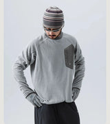 Mountain-Ready Crewneck: Engineered with Ribbed Neck, Reflective Logo, & Secure Chest Pocket for Outdoor Style Unisex