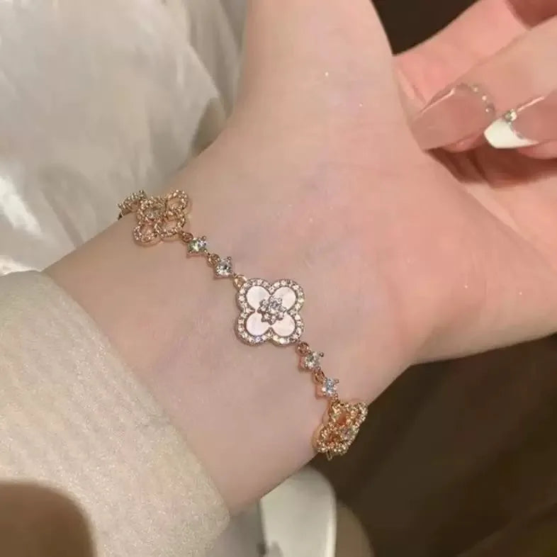 GLOSSMOON Sakura Cleef Bracelet Fashionable and Elegant Cherry Blossom Bracelet Does Not Change Color and Is Not Allergic  The Sakura Clover Bracelet showcases a multitude of brilliant diamonds, forming a luminous sparkle tha