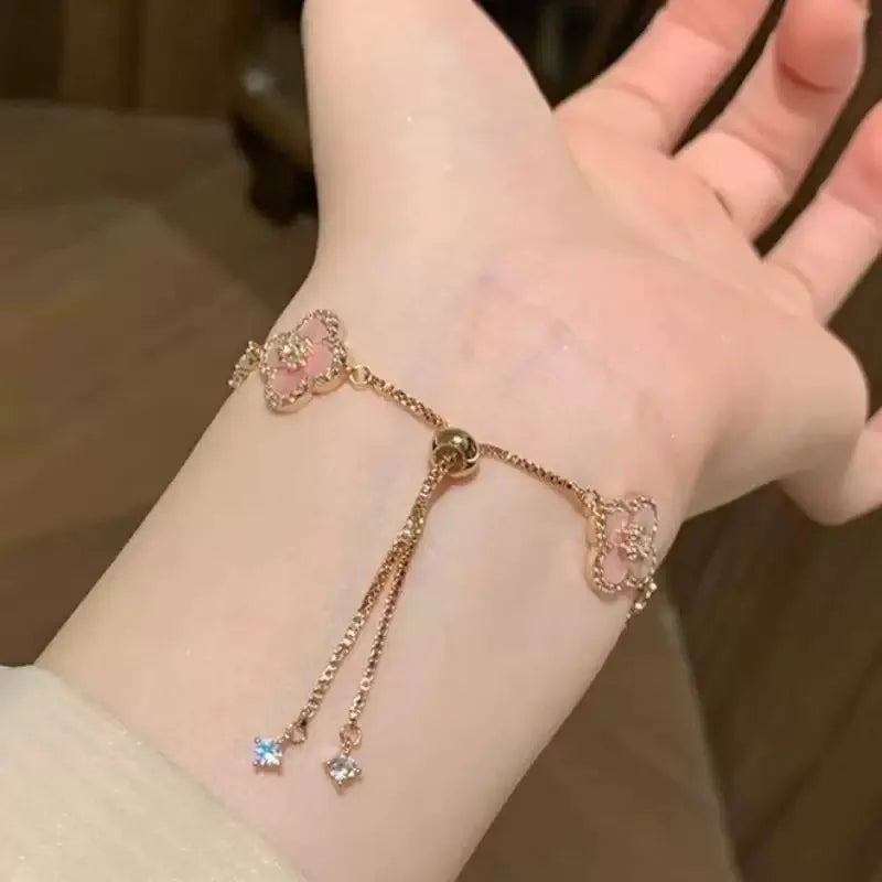 GLOSSMOON Sakura Cleef Bracelet Fashionable and Elegant Cherry Blossom Bracelet Does Not Change Color and Is Not Allergic  The Sakura Clover Bracelet showcases a multitude of brilliant diamonds, forming a luminous sparkle tha